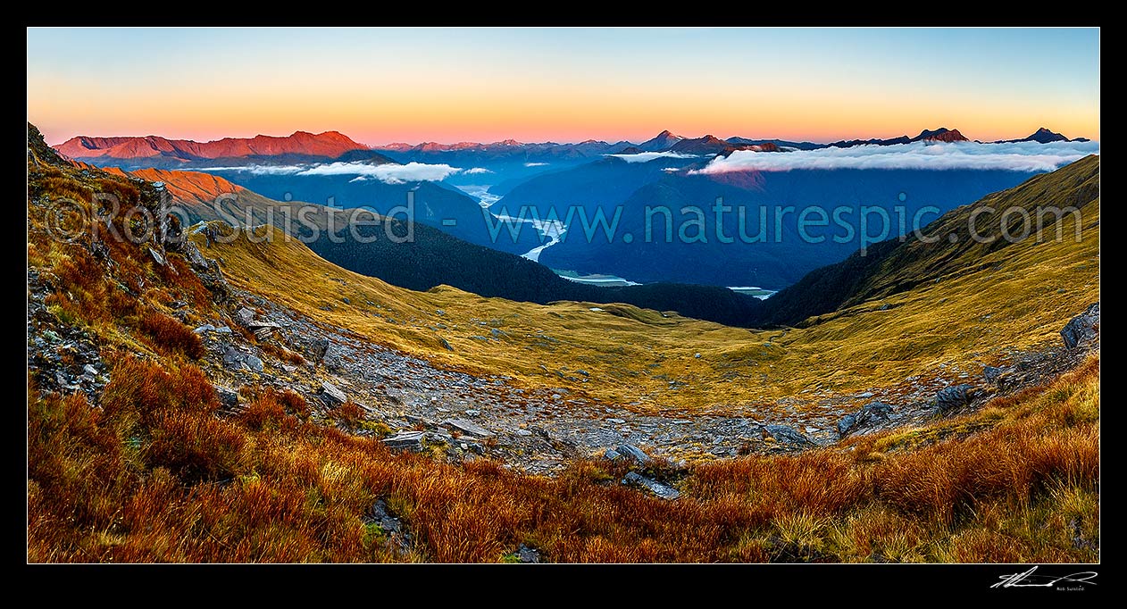 Image of Haast River Valley sunset from the Thomas Range, Crow Creek. Mount Brewster (2515m) centre left, with Haast Range right distance. Panorama, Haast, Westland District, West Coast Region, New Zealand (NZ) stock photo image