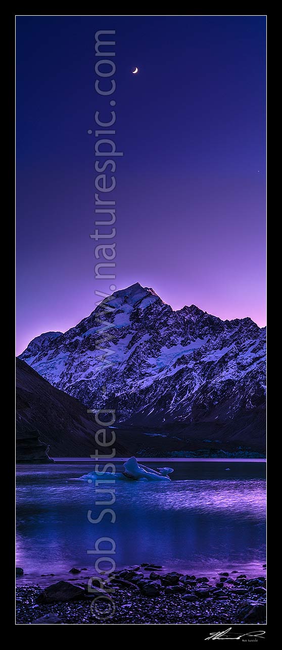 Image of Aoraki / Mount Cook (3754m) at dawn, with moon high above. Hooker Lake and icebergs below. Pre dawn colours. Vertical panorama, Aoraki / Mount Cook National Park, MacKenzie District, Canterbury Region, New Zealand (NZ) stock photo image