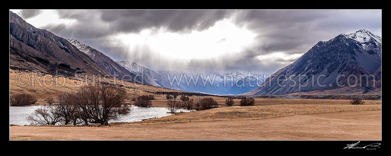 Image of Ahuriri River Valley headwaters. Ben Avon Scenic Reserve lake and wetlands, with stormy weather in headwaters. Huxley Range beyond left. Moody panorama, Ahuriri River, Waitaki District, Canterbury Region, New Zealand (NZ) stock photo image