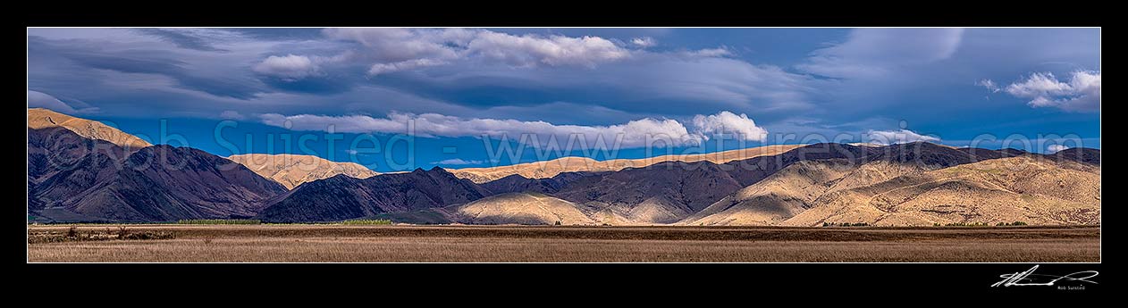 Image of Morning light and clouds on the Ewe and St Cuthbert Range south of Omarama (land of light). High country farming stations in the Mackenzie Basin. Tara Hills. Panorama, Omarama, Waitaki District, Canterbury Region, New Zealand (NZ) stock photo image