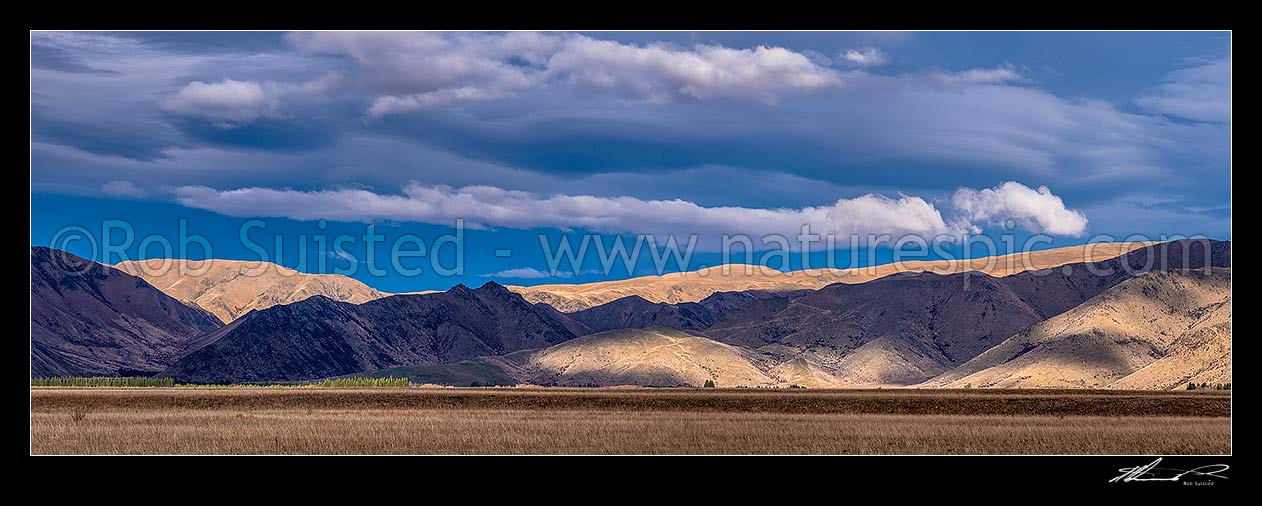 Image of Morning light and clouds on the Ewe and St Cuthbert Range south of Omarama (land of light). High country farming stations in the Mackenzie Basin. Tara Hills. Panorama, Omarama, Waitaki District, Canterbury Region, New Zealand (NZ) stock photo image