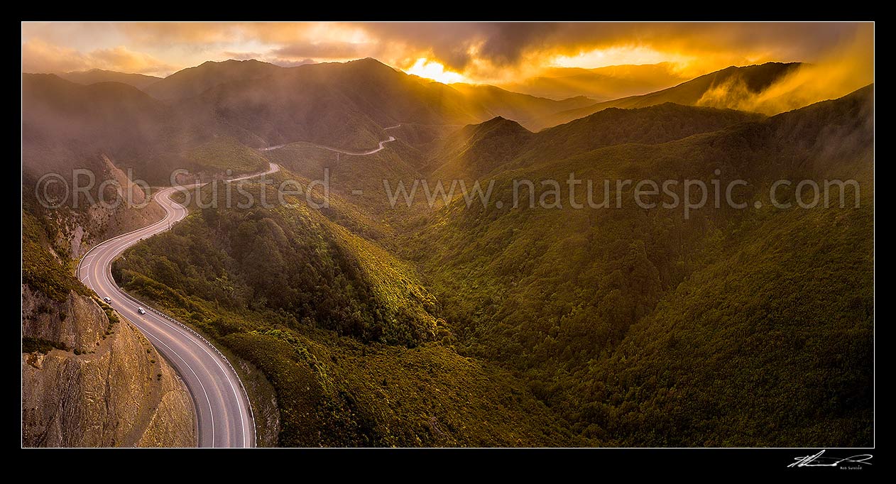 Image of Remutaka (Rimutaka) Hill Road (State Highway 2, SH2) climbing over the Remutaka (Rimutaka) Ranges (to 555m) from Upper Hutt to the Wairarapa. Aerial panorama on a moody evening, Remutaka, Upper Hutt City District, Wellington Region, New Zealand (NZ) stock photo image