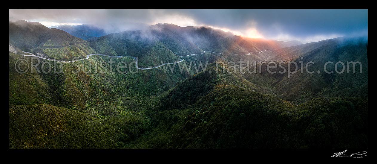 Image of Remutaka (Rimutaka) Hill Road (State Highway 2, SH2) climbing over the Remutaka (Rimutaka) Ranges (to 555m) from Upper Hutt to the Wairarapa. Aerial panorama on a moody evening, Remutaka, Upper Hutt City District, Wellington Region, New Zealand (NZ) stock photo image