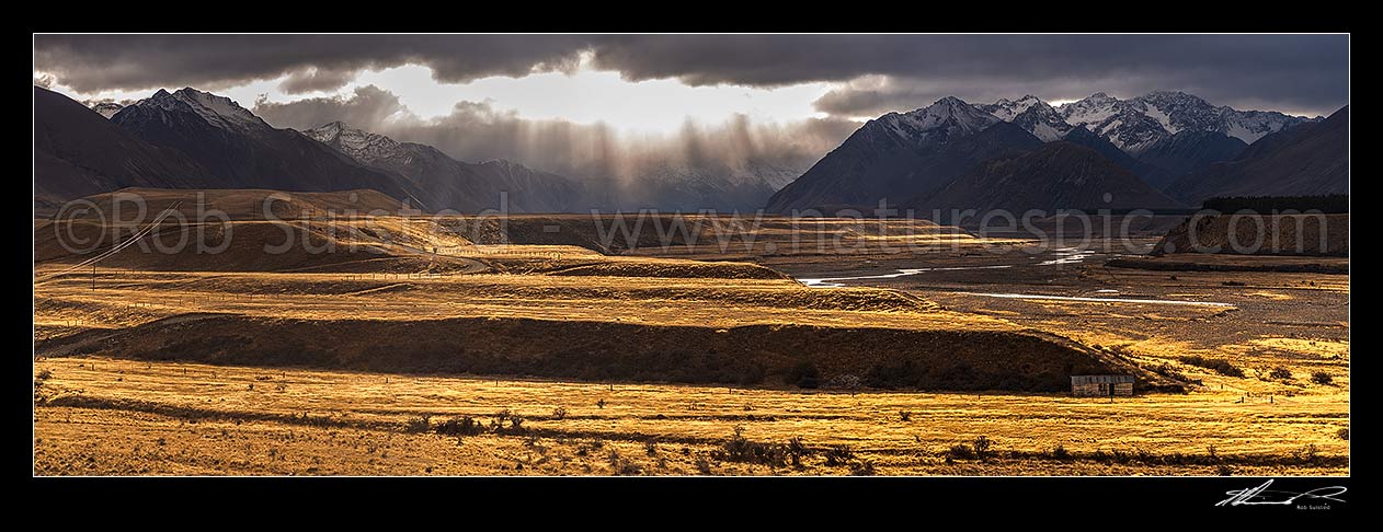 Image of Ahuriri River Valley in breaking weather. Huxley Range (left), Barrier Range (right) and Ahuriri Conservation Park beyond. Ben Avon Station. Panorama, Ahuriri River, Waitaki District, Canterbury Region, New Zealand (NZ) stock photo image