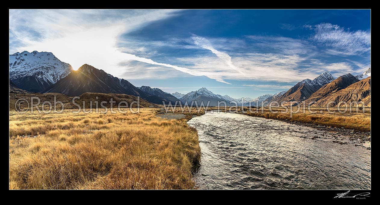 Image of Tasman Valley sunset, with Aoraki Mt Cook (3754m) centre above clear mountain stream. Ben Ohau Range left, and Burnett Mountains right. Panorama, Aoraki / Mount Cook National Park, MacKenzie District, Canterbury Region, New Zealand (NZ) stock photo image