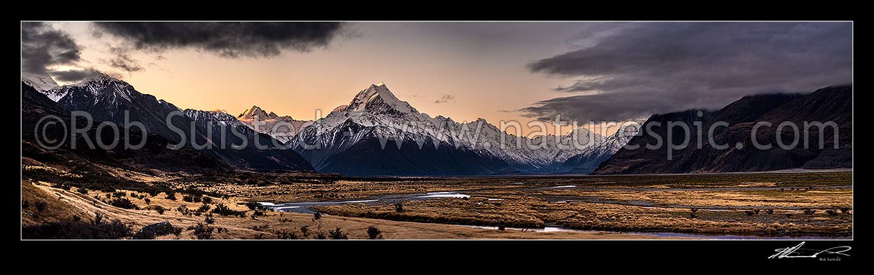 Image of Aoraki Mount Cook above the Tasman Valley at dusk. Mt Cook Range centre, Mt Sefton left centre. Panorama, Aoraki / Mount Cook National Park, MacKenzie District, Canterbury Region, New Zealand (NZ) stock photo image