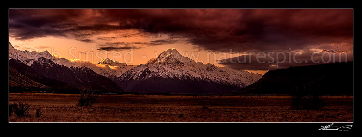 Image of Aoraki Mount Cook sunset. Tasman Valley at dusk. Mt Cook Range centre, Ben Ohau Range, Sealy Range, Mt Sefton and Hooker Valley left, Tasman Valley right. Panorama, Aoraki / Mount Cook National Park, MacKenzie District, Canterbury Region, New Zealand (NZ) stock photo image