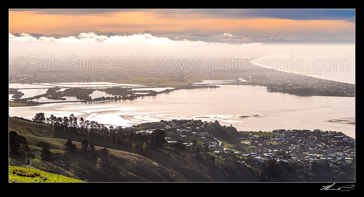 Image of Christchurch City panorama. Looking over the Heathcoate Avon estuary as weather change brings fog. Pegaus Bay and New Brighton Pier right. Seen from The Port Hills, Christchurch, Christchurch City District, Canterbury Region, New Zealand (NZ) stock photo image