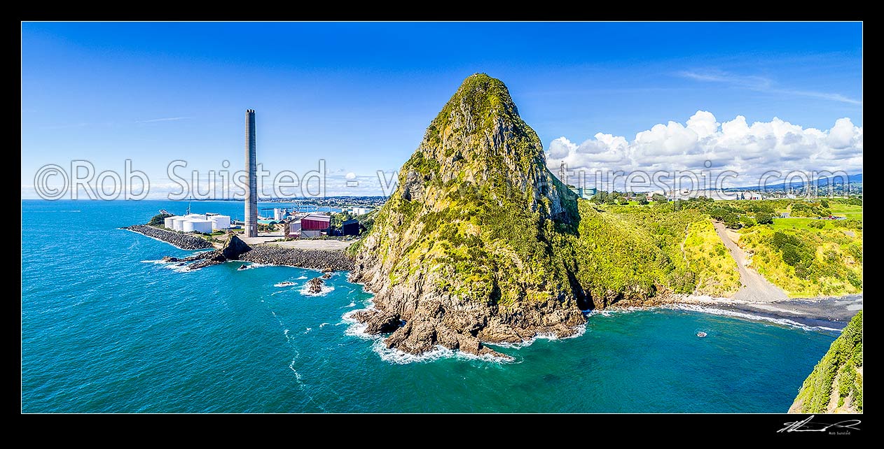 Image of Paritutu Rock (154m) above the Sugarloaf Islands sanctuary (Nga Motu). New Plymouth power station chimney (198m high) at left. Aerial panorama, New Plymouth, New Plymouth District, Taranaki Region, New Zealand (NZ) stock photo image