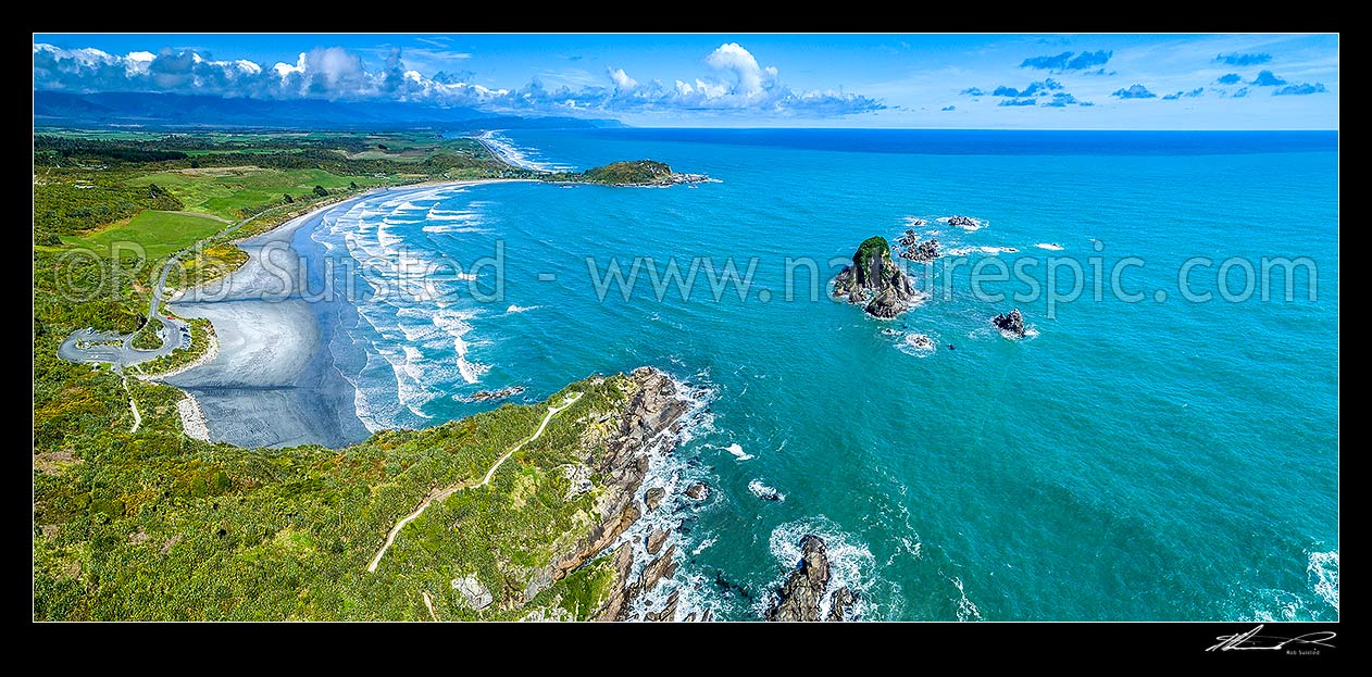 Image of Tauranga Bay Beach and Cape Foulwind Walkway. Wall Island right, and Okari Lagoon visible in distance. Aerial panorama, Cape Foulwind, Buller District, West Coast Region, New Zealand (NZ) stock photo image