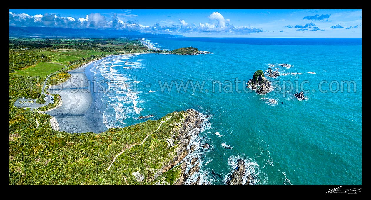 Image of Tauranga Bay Beach and Cape Foulwind Walkway. Wall Island right, and Okari Lagoon visible in distance. Aerial panorama, Cape Foulwind, Buller District, West Coast Region, New Zealand (NZ) stock photo image