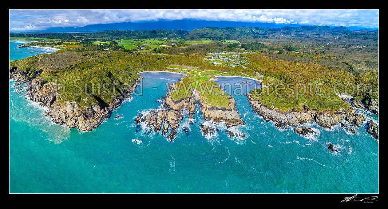 Image of Charleston coastline. Joyce Bay and Constant Bay centre, with Little Beach and Nine Mile Beach far left, Doctors Bay far right. Charleston township beyond. Aerial panorama, Charleston, Buller District, West Coast Region, New Zealand (NZ) stock photo image