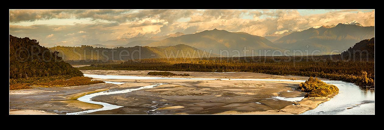 Image of Wanganui River in lower reaches, looking inland towards the Southern Alps from coast. Mt Bonar (1076m) centre right. Evening panorama, Harihari, Westland District, West Coast Region, New Zealand (NZ) stock photo image