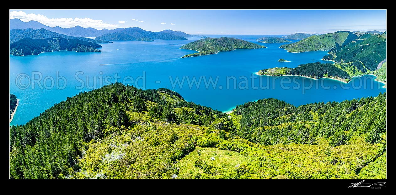 Image of Cooks Lookout on southern Arapaoa (Arapawa) Island overlooking Queen Charlotte Sound. Blumine Island centre, Umuwheke Bay at right. Aerial panorama. Ngaruru Scenic Reserve, Arapawa Island, Marlborough Sounds, Marlborough District, Marlborough Region, New Zealand (NZ) stock photo image