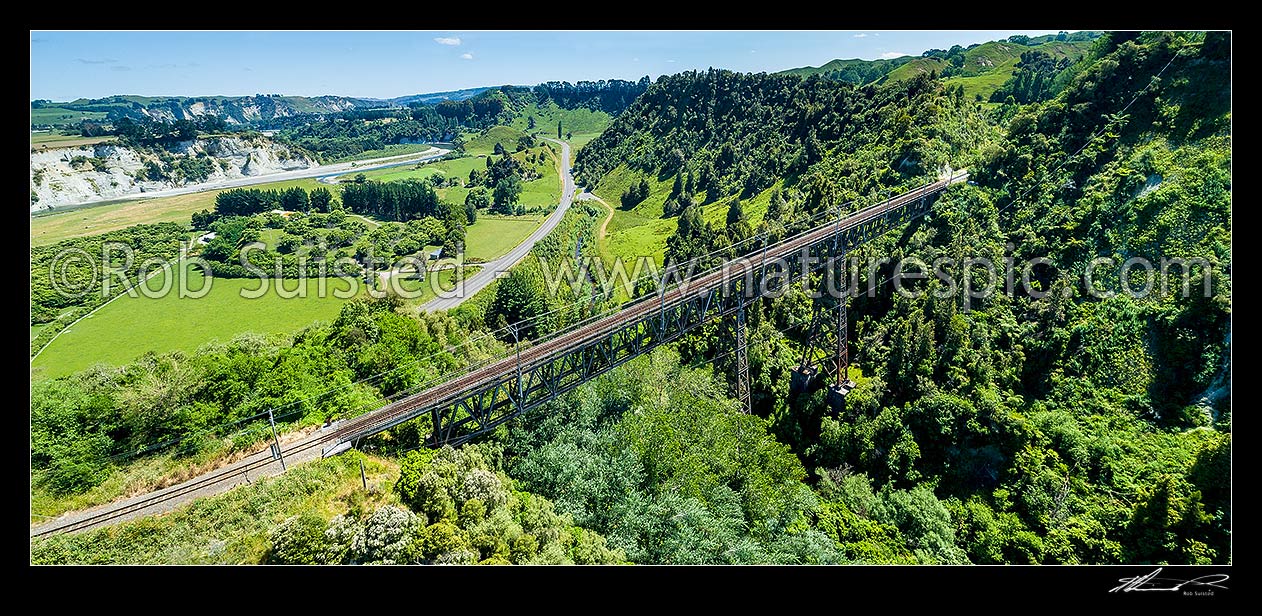 Image of Makohine Viaduct, finished in 1902 as part of the North Island Main Trunk (NIMT) railway. 72 metres high and 228m span. Aerial panorama over bridge, SH1 and Rangitikei River valley, Ohingaiti, Rangitikei District, Manawatu-Wanganui Region, New Zealand (NZ) stock photo image