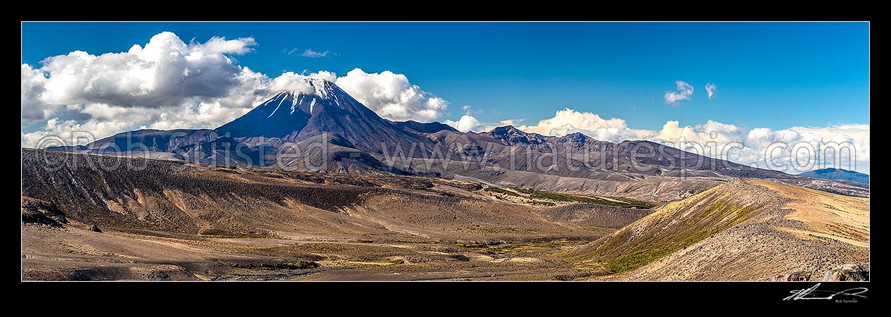 Image of Mt Ngauruhoe (2287m) standing above the dry barren volcanic landscape of the Rangipo Desert and Mangatoetoenui stream on the Round the Mountain Track. Panorama, Tongariro National Park, Taupo District, Waikato Region, New Zealand (NZ) stock photo image