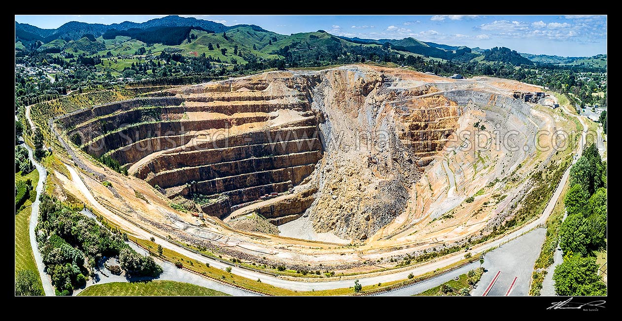 Image of Martha Hill Mine at Waihi, large old open cast pit gold mine beside the town. Mine collapse visible. Aerial view, Waihi, Hauraki District, Waikato Region, New Zealand (NZ) stock photo image