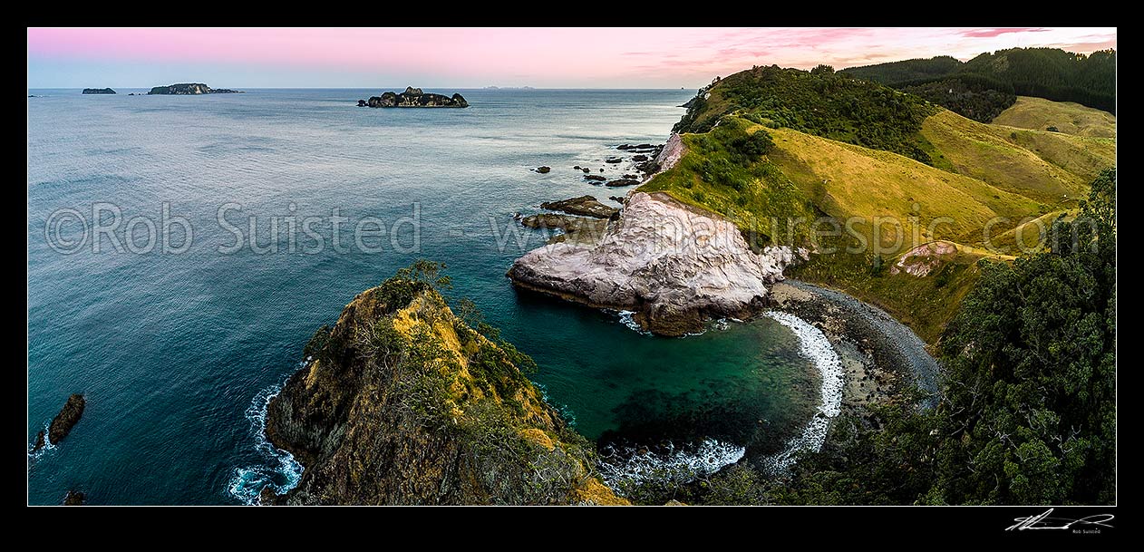 Image of Opito Point Historic Reserve coast and coves looking south east past Motukoruenga Island to distant The Alderman Islands. Aerial panorma at dusk, Opito Bay, Coromandel Peninsula, Thames-Coromandel District, Waikato Region, New Zealand (NZ) stock photo image