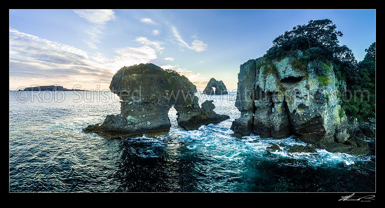 Image of Motukoruenga Island and rocks, with Needle Island behind centre. Ohinau and Ohinauiti Island far left. Hole in the Wall channel. Panorama, Opito Bay, Coromandel Peninsula, Thames-Coromandel District, Waikato Region, New Zealand (NZ) stock photo image