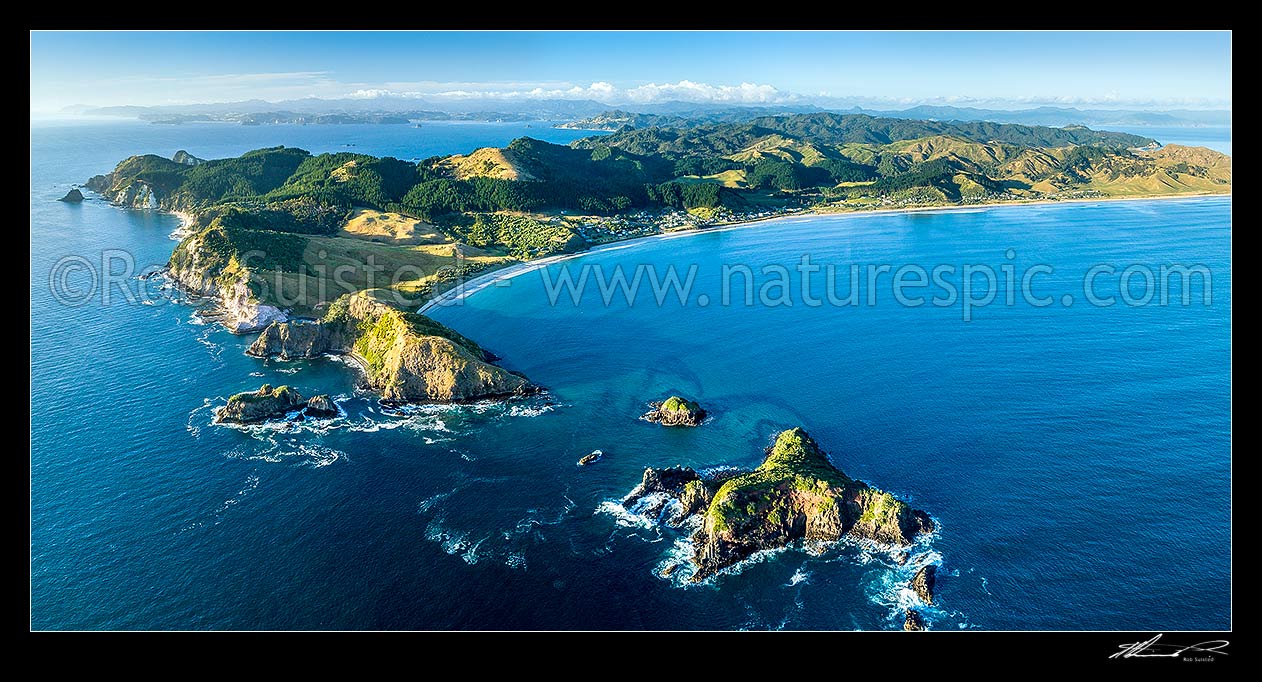 Image of Opito Bay and Opito Beach aerial panorama. Opito Point at left and Rabbit Island foreground. Mercury Bay distant left, Opito Bay, Coromandel Peninsula, Thames-Coromandel District, Waikato Region, New Zealand (NZ) stock photo image