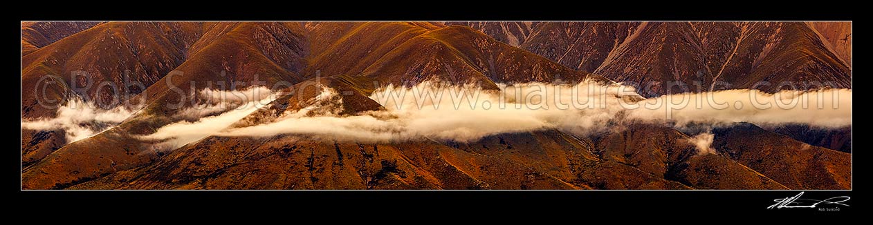 Image of High country evening cloud cloaking ridges above Omarama. Benmore Range. Panorama, Omarama, Waitaki District, Canterbury Region, New Zealand (NZ) stock photo image