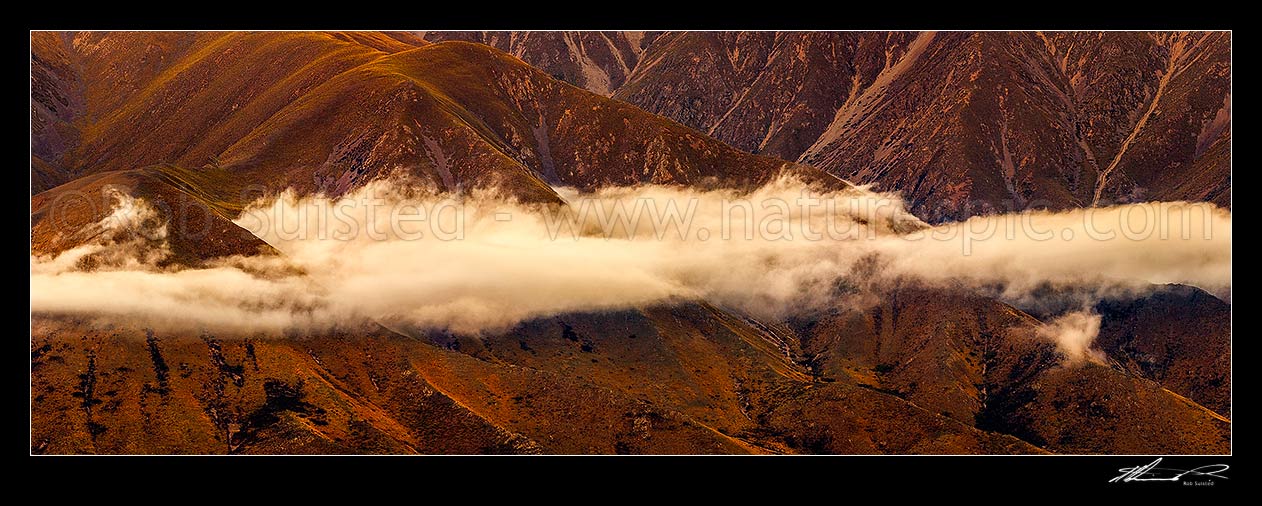 Image of High country evening cloud cloaking ridges above Omarama. Benmore Range. Panorama, Omarama, Waitaki District, Canterbury Region, New Zealand (NZ) stock photo image