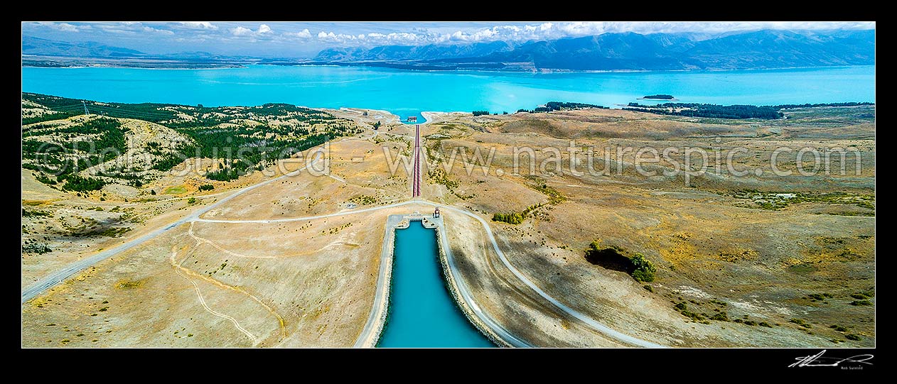 Image of Tekapo B (Pukaki) power station for hydroelectric power generation, fed by penstock from the Tekapo Canal stilling basin into Lake Pukaki, MacKenzie Basin. Aerial view, Lake Pukaki, MacKenzie District, Canterbury Region, New Zealand (NZ) stock photo image