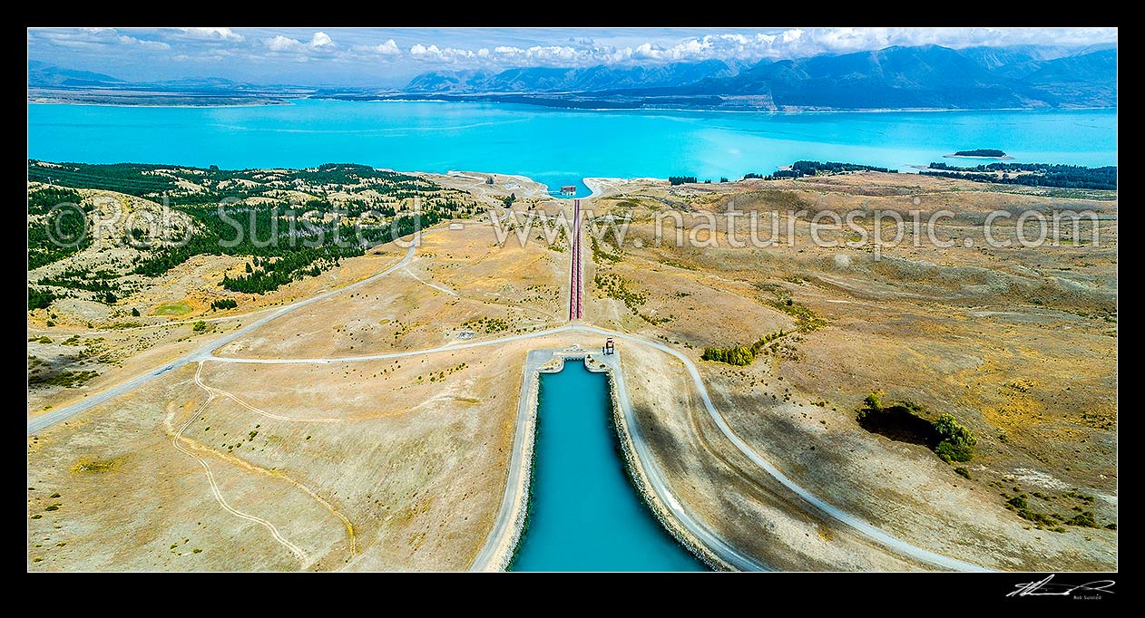 Image of Tekapo B (Pukaki) power station for hydroelectric power generation, fed by penstock from the Tekapo Canal stilling basin into Lake Pukaki, MacKenzie Basin. Aerial view, Lake Pukaki, MacKenzie District, Canterbury Region, New Zealand (NZ) stock photo image