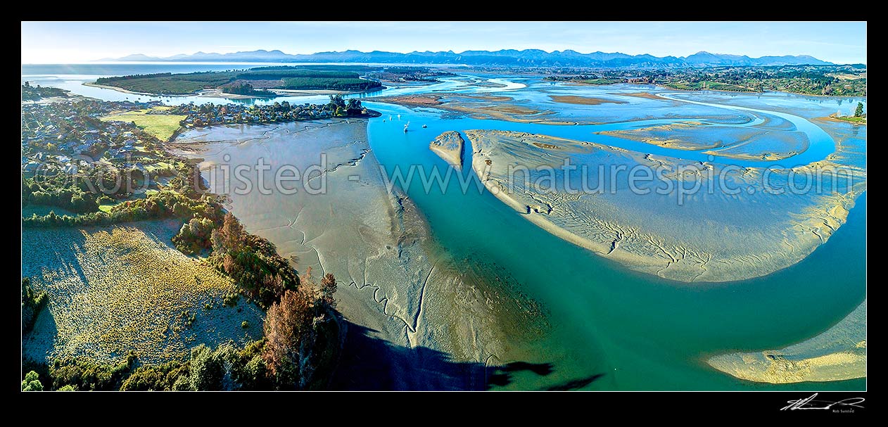 Image of Waimea Inlet estuary, with Mapua, Grossi Point, Rabbit Island and Nelson beyond. Aerial panorama over sand and mudflats at low tide, Mapua, Tasman District, Tasman Region, New Zealand (NZ) stock photo image