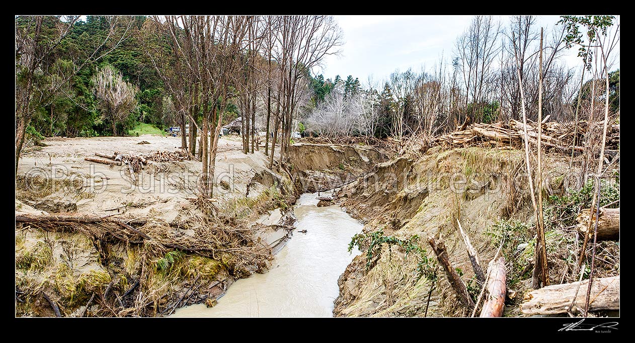 Image of Tolaga Bay floods in June 2018 brought large amounts of forestry timber slash and sediment down Mangatokerau River. Note forestry high above water level. Panorama, Tolaga Bay, Gisborne District, Gisborne Region, New Zealand (NZ) stock photo image