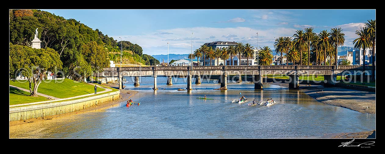 Image of Gisborne City and Turanganui River, with young people practicing Waka Ama outrigger canoe racing near the Gladstone Road Bridge. Panorama, Gisborne City, Gisborne District, Gisborne Region, New Zealand (NZ) stock photo image