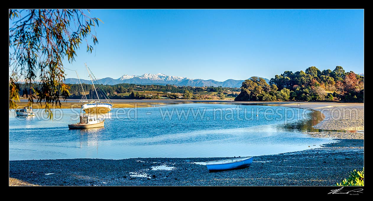 Image of Waimea Inlet at low tide with boats on moorings at Mapua. Kahurangi National Park and Arthur Range beyond. Panorama, Mapua, Tasman District, Tasman Region, New Zealand (NZ) stock photo image