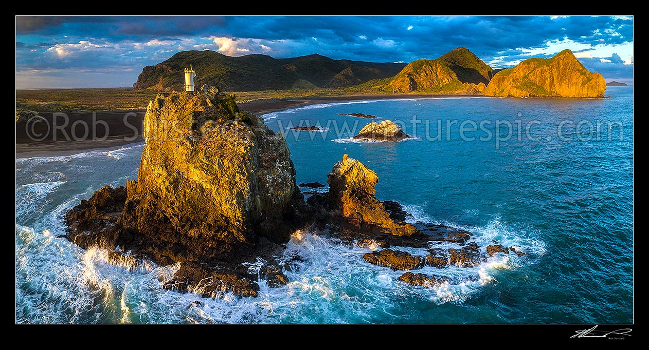 Image of Ninepin Rock and lighthouse (or beacon) by Whatipu Beach. Paratutae island and Manukau Harbour entrance at right. Aerial panorama, Whatipu Beach, Waitakere City District, Auckland Region, New Zealand (NZ) stock photo image