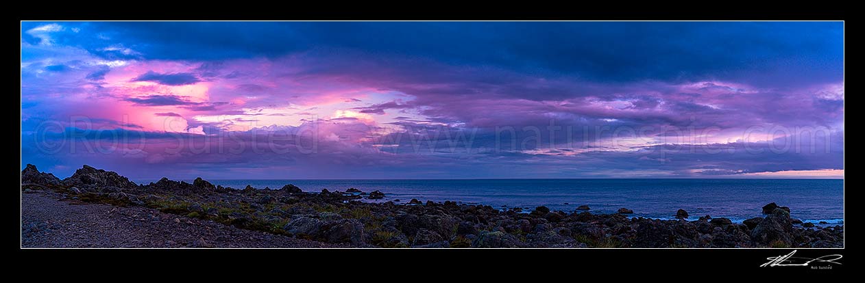 Image of Turakirae Head Scientific Reserve with twilight coloured sky above at sunset. Cook Strait beyond. Panorama, Turakirae Head, Hutt City District, Wellington Region, New Zealand (NZ) stock photo image