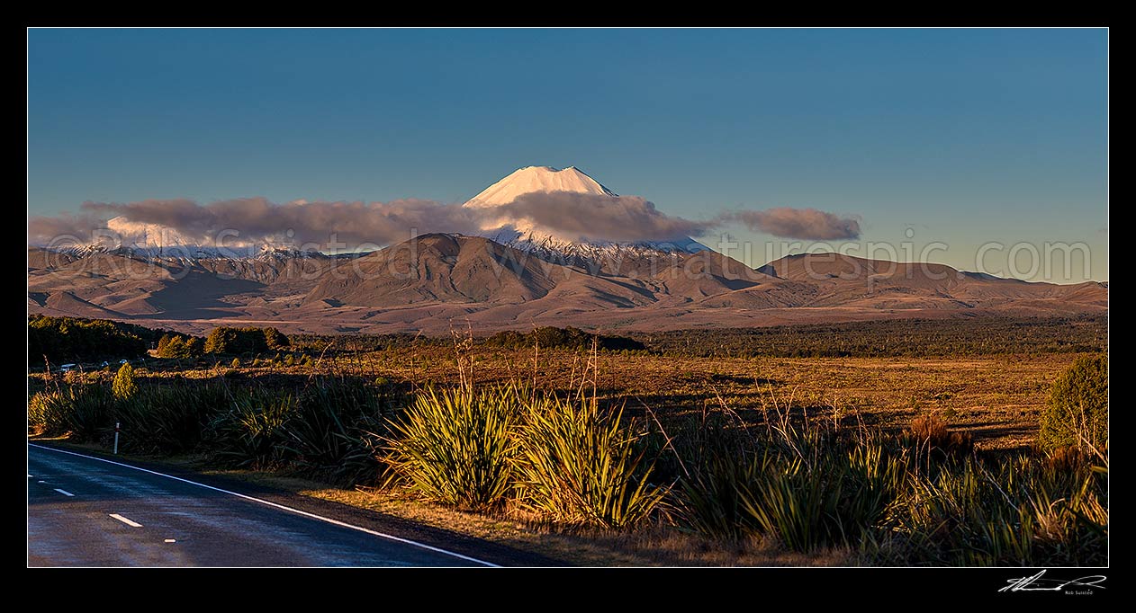 Image of Mt Ngauruhoe (2287m), a volcano in Tongariro National Park. Mount Tongariro obscured by cloud to left. Panorama from State Highway 47, Tongariro National Park, Ruapehu District, Manawatu-Wanganui Region, New Zealand (NZ) stock photo image