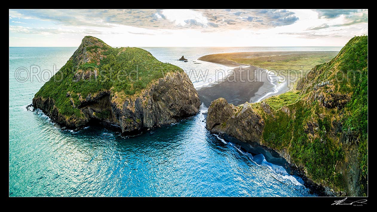 Image of Whatipu Beach, with Paratutae Island (left) at the entrance to Manukau Harbour. Ninepin Rock beyond (centre) and Burnett Head at right. Waitakere Regional Park. Aerial panorama, Whatipu Beach, Waitakere City District, Auckland Region, New Zealand (NZ) stock photo image