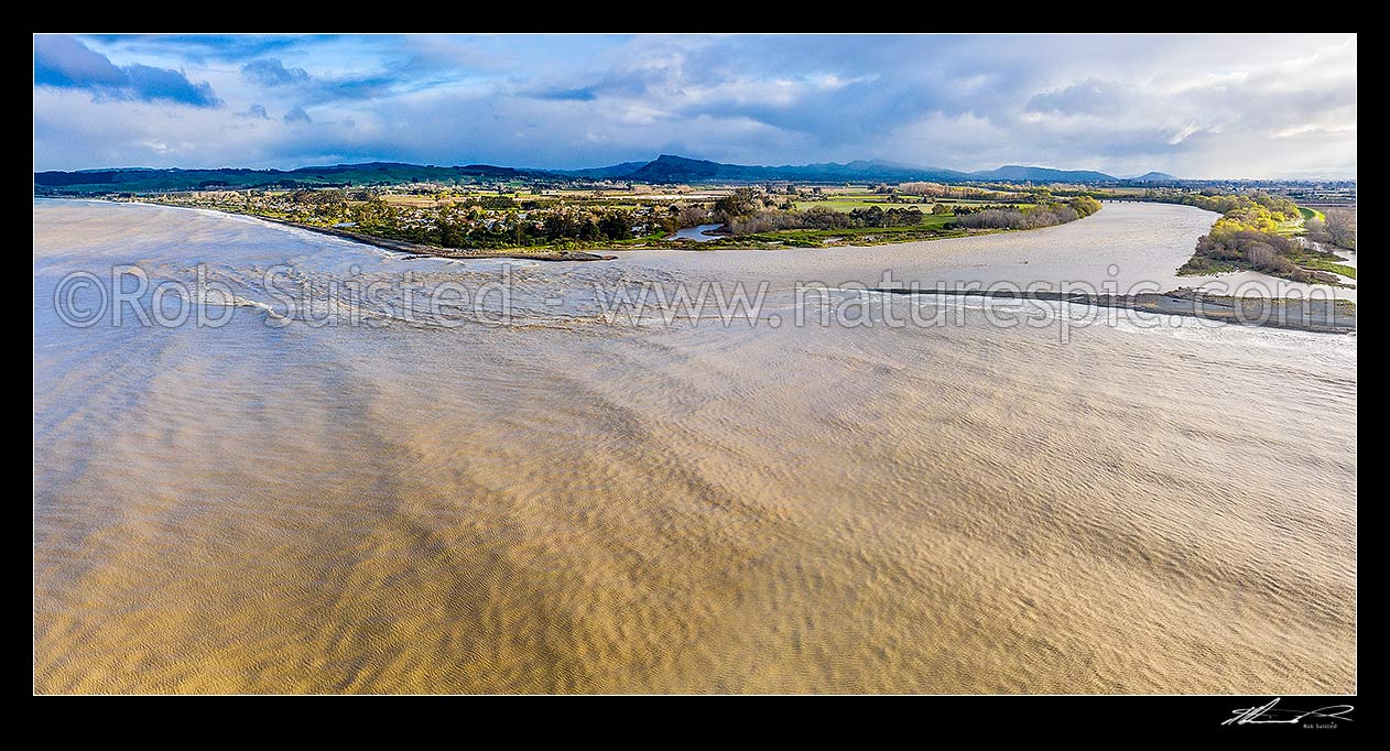 Image of Tukituki River mouth and estuary, in flood after heavy rain. Town of Haumoana at left, with Te Mata Peak beyond. Aerial panorama, Clive, Hastings District, Hawke's Bay Region, New Zealand (NZ) stock photo image