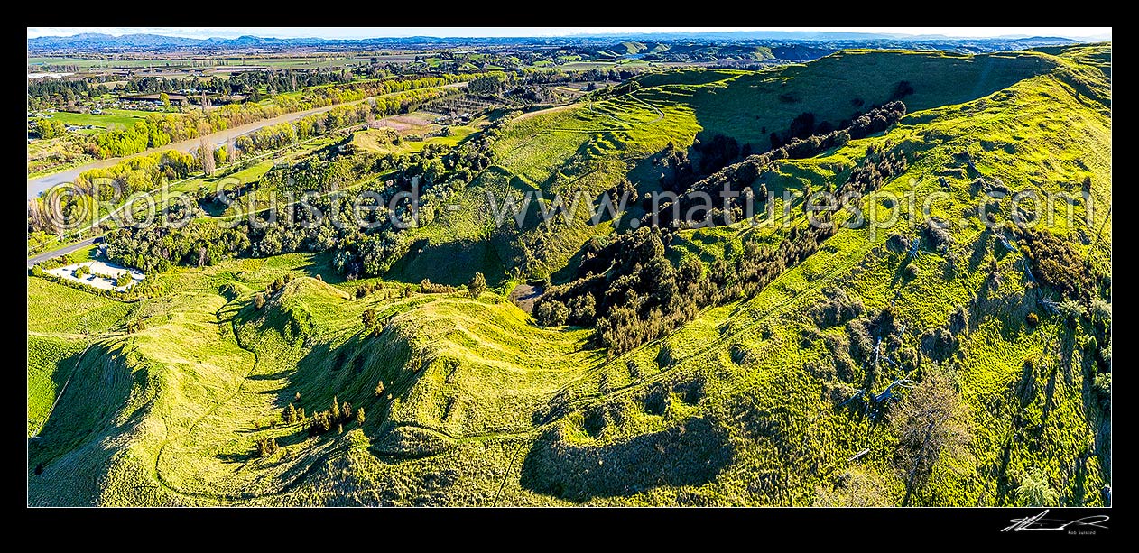 Image of Otatara Pa Historic Reserve near Waiohiki, beside the Tutaekuri River. One of the largest pa complexes in NZ, with earthworks visible. Administered by DOC. Aerial panorama, Taradale, Napier City District, Hawke's Bay Region, New Zealand (NZ) stock photo image