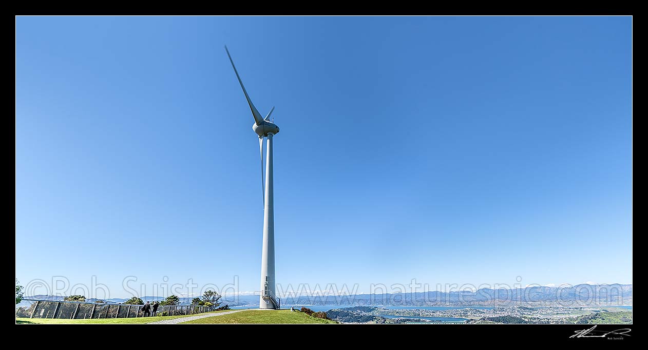 Image of Wind turbine above Wellington on Brooklyn Hill, over looking Wellington City and Harbour beyond.  Panorama, Wellington, Wellington City District, Wellington Region, New Zealand (NZ) stock photo image