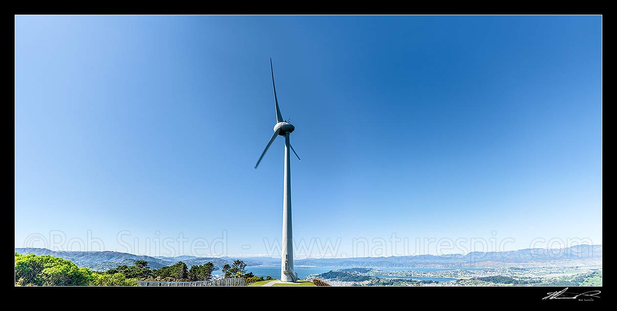 Image of Wind turbine above Wellington on Brooklyn Hill, over looking Wellington City and Harbour beyond.  Panorama, Wellington, Wellington City District, Wellington Region, New Zealand (NZ) stock photo image