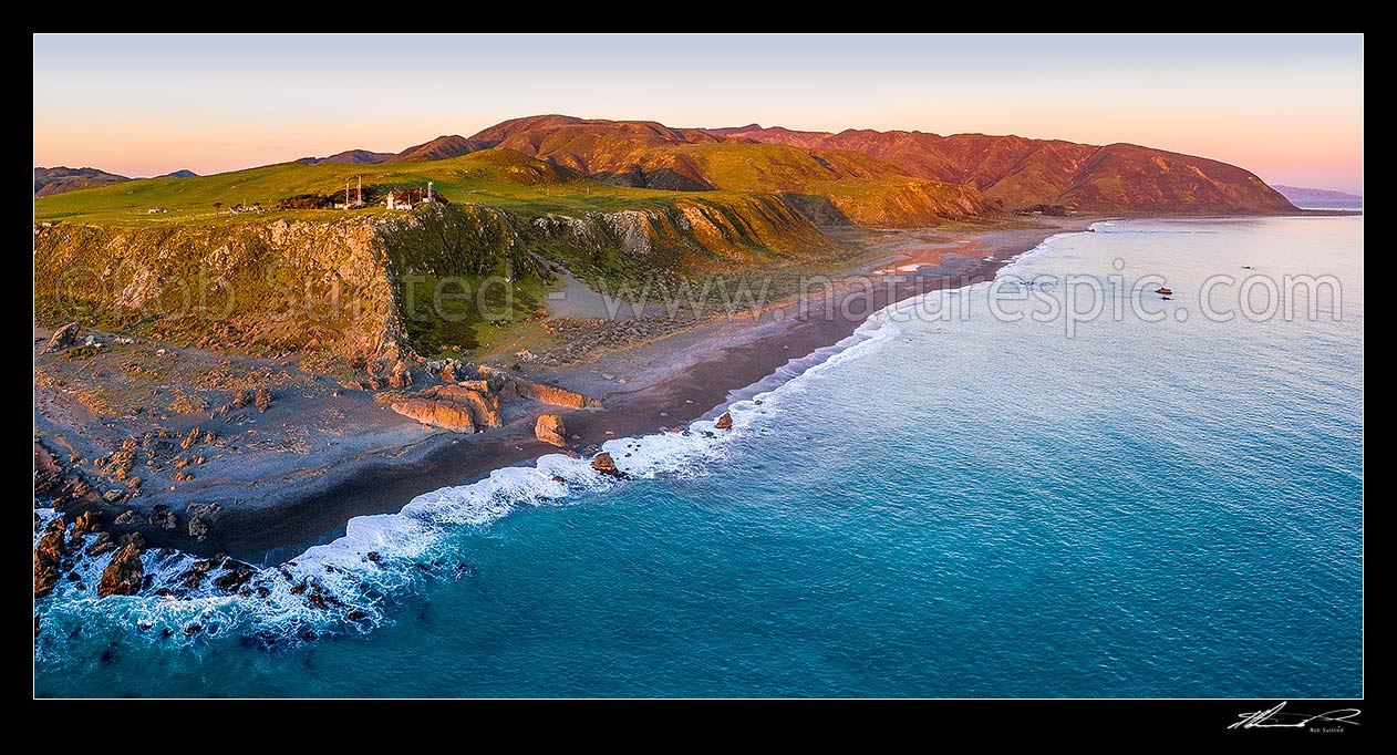 Image of Baring Head lighthouse aerial panorama with Wainuiomata River mouth, Orongorongo Station and Turakirae Head at right. East Harbour Regional Park at dusk, Baring Head, Hutt City District, Wellington Region, New Zealand (NZ) stock photo image