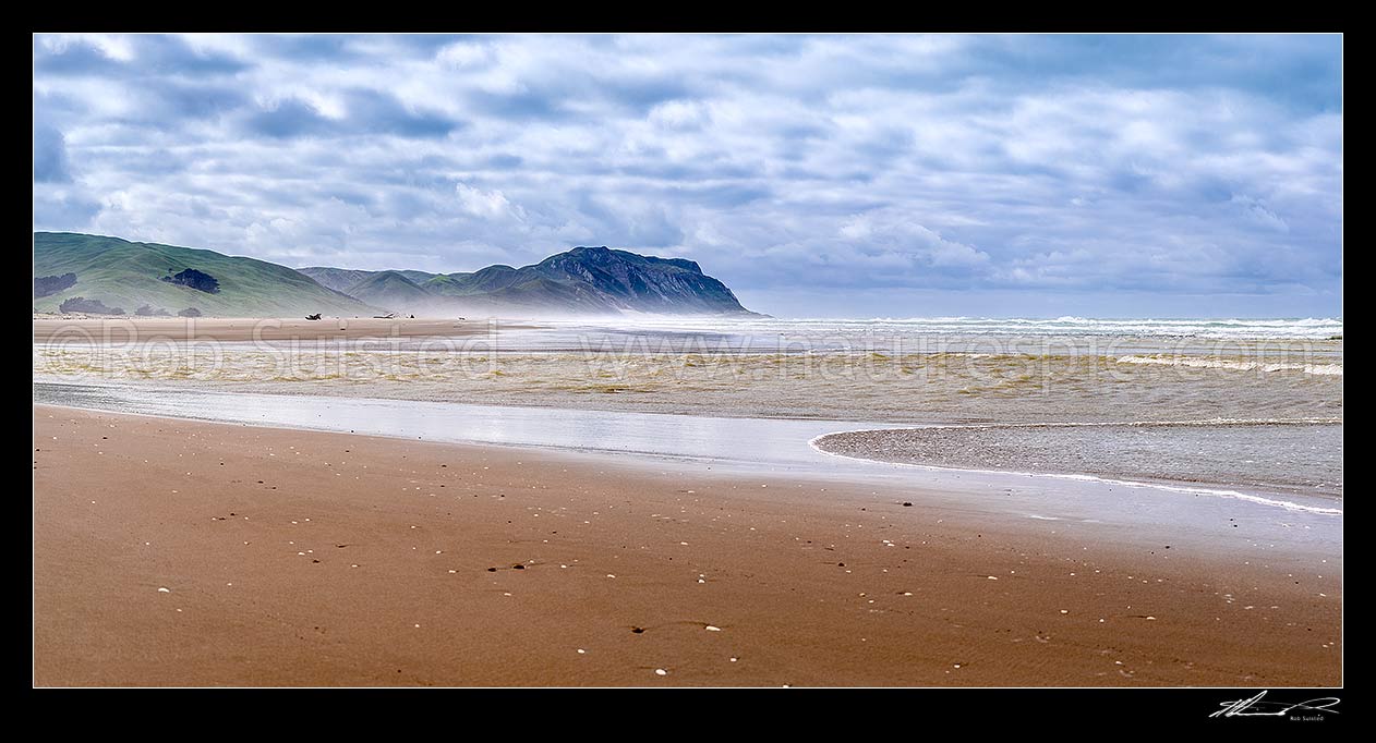 Image of Cape Turnagain, prominent headland off central Hawke's Bay, seen from Herbertville coast. Named by Captain James Cook in 1769 as the point he turned to head north. Panorama, Herbertville, Tararua District, Manawatu-Wanganui Region, New Zealand (NZ) stock photo image