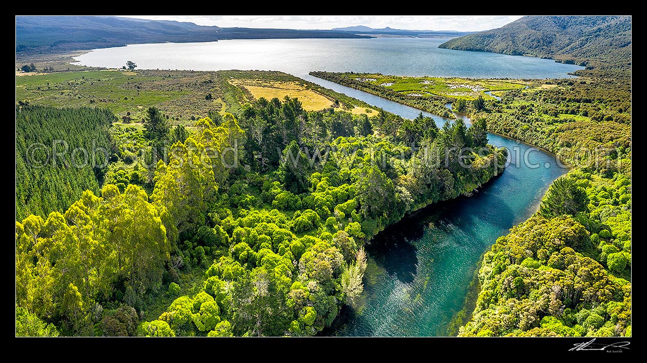 Image of Lake Rotoaira outlet at Poutu Stream. Historic site of Lieutenant Colonel McDonnell's 1869 Redoubt camp, while pursuing Te Kooti, in foreground. Aerial view, Lake Rotoaira, Taupo District, Waikato Region, New Zealand (NZ) stock photo image