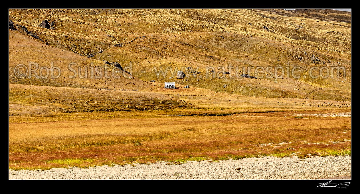 Image of Nevis River Valley, a remote backcountry valley between Bannockburn and Garston. Old musterers hut visible in the Garvie Mountains. Panorama, Nevis, Central Otago District, Otago Region, New Zealand (NZ) stock photo image