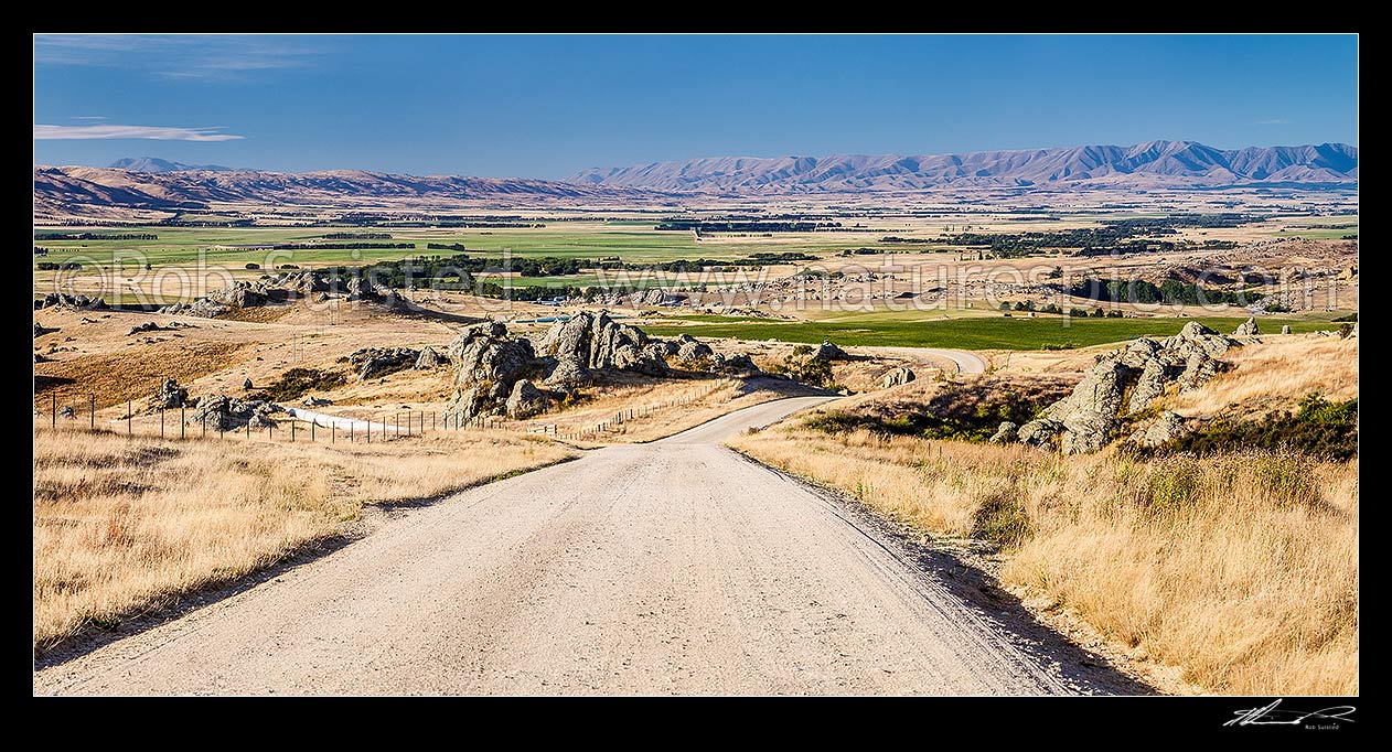 Image of Upper Taieri Plain seen from near Paerau. Panorama over irrigated plains of the Upper Taieri towards the Hawkdun and Ida Ranges. Summer, Patearoa, Central Otago District, Otago Region, New Zealand (NZ) stock photo image