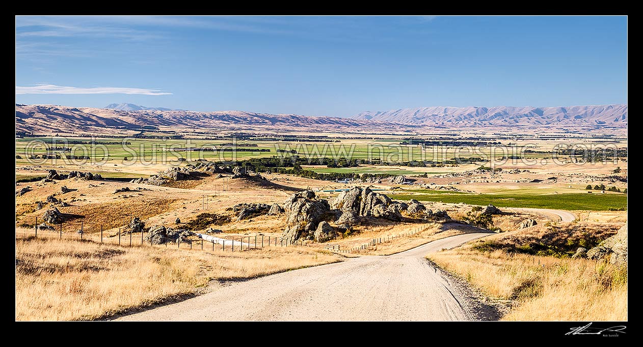 Image of Upper Taieri Plain seen from near Paerau. Panorama over irrigated plains of the Upper Taieri towards the Hawkdun and Ida Ranges. Maniototo, Patearoa, Central Otago District, Otago Region, New Zealand (NZ) stock photo image