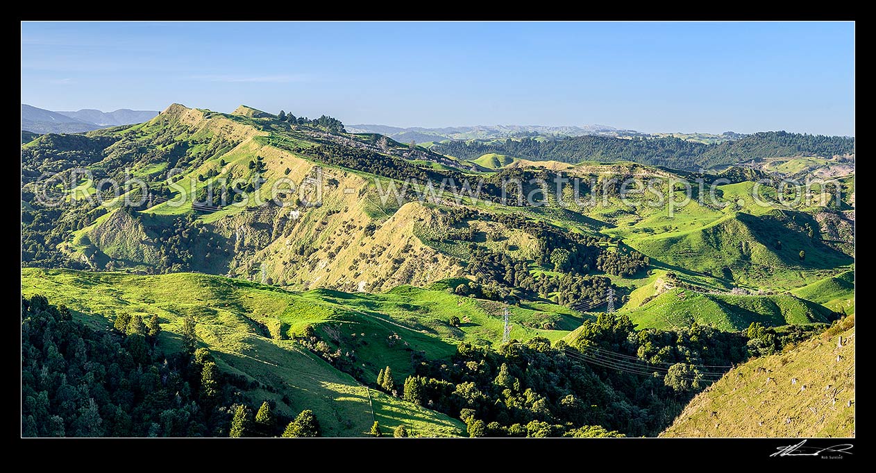 Image of Northern Hawkes Bay hill country farmland of the Mangaone Stream Waiau River area. Panorama with native forest remnants, Mohaka, Wairoa District, Hawke's Bay Region, New Zealand (NZ) stock photo image