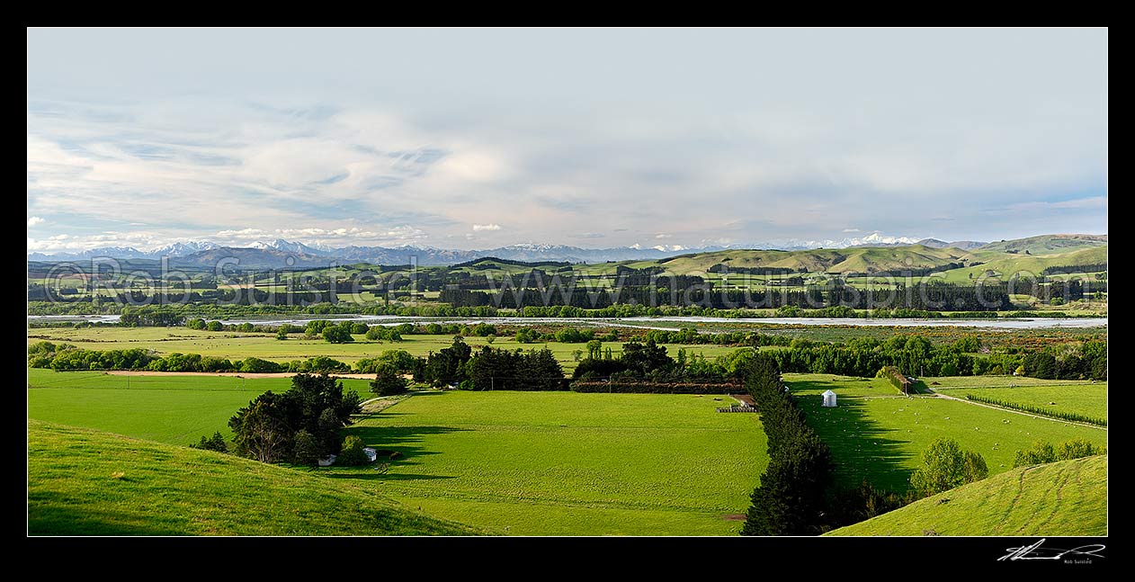 Image of Hurunui River and farmland near Domett, panorama with the Kaikoura Ranges and Mount Tapuae-o-Uenuku (centre) behind, Hurunui Mouth, Hurunui District, Canterbury Region, New Zealand (NZ) stock photo image