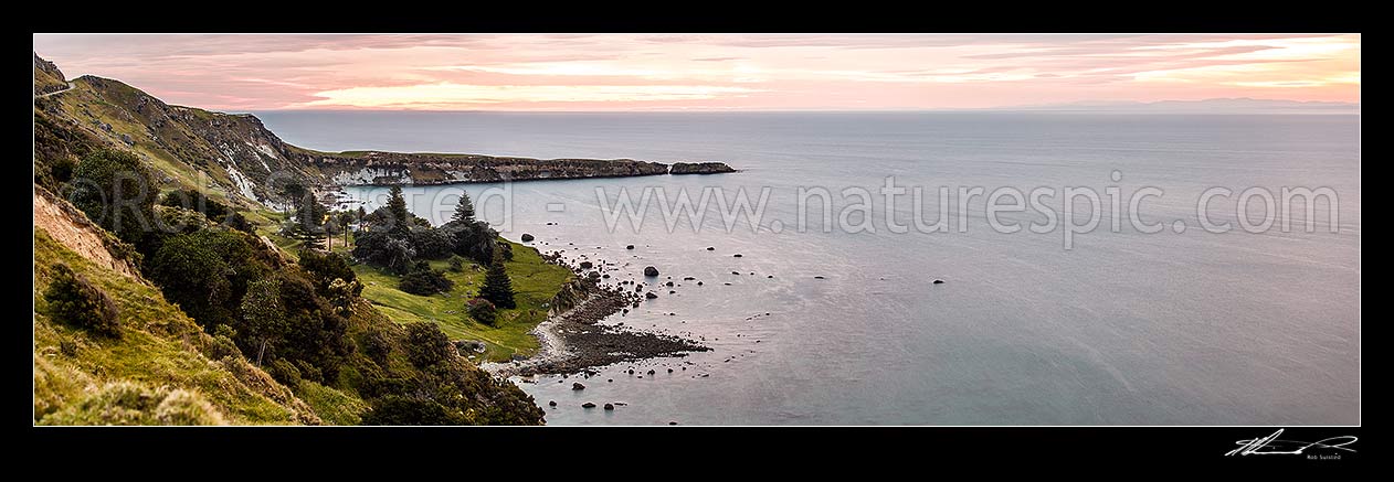 Image of Kinikini Point, with Taramahiti Point (Long Point) behind, on Mahia Peninsula, at dusk. Kinikini Station. Looking south into Hawke Bay. Panorama, Mahia, Wairoa District, Hawke's Bay Region, New Zealand (NZ) stock photo image