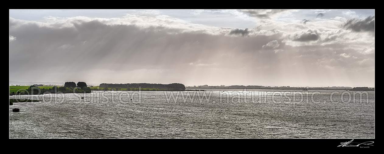 Image of Lake Waikare, on a moody spring day. Duck hunting maimais dotting the lake.  Panorama, Te Kauwhata, Waikato District, Waikato Region, New Zealand (NZ) stock photo image